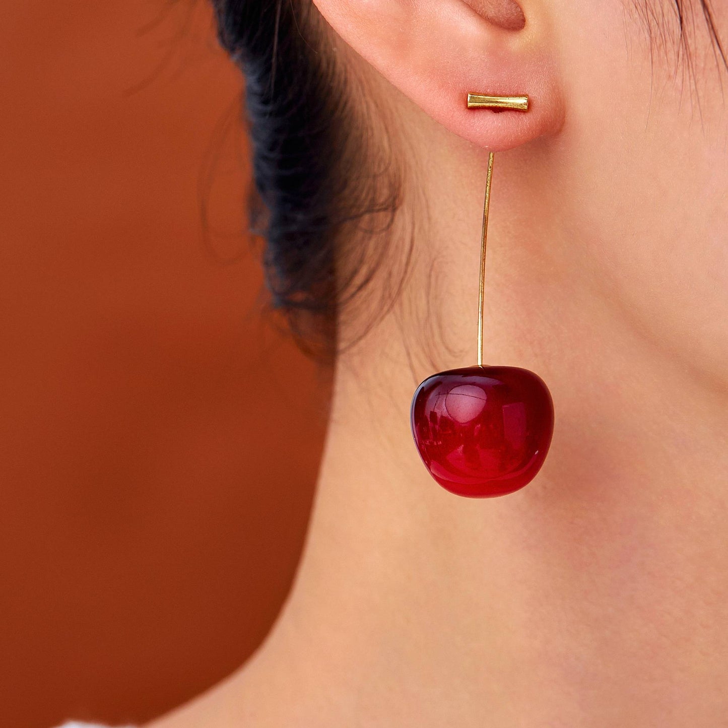 Cherry Pop red cherry earrings on model – glossy fruit-inspired jewellery for women by Orlaya Jewellery
