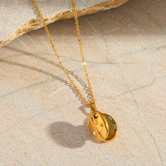 Gold celestial locket necklace with keepsake space inside
