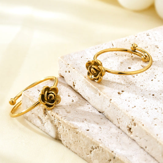 Gold rose flower ring close-up on finger – dainty minimal jewelry with floral motif for daily wear