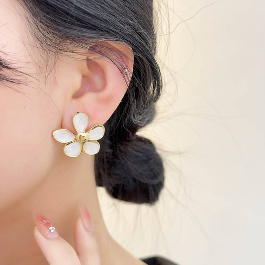 gold-plated floral stud earrings with delicate petals, lightweight and luminous design by Orlaya Jewellery.