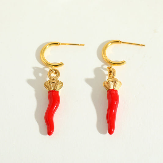 Calabria Charm gold earrings with red chilli charms flat lay