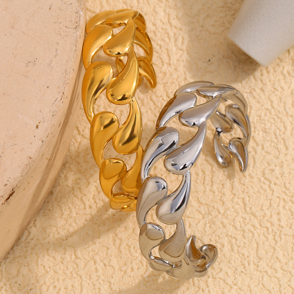 Aurora Drop Cuff Bracelet in gold with teardrop link design