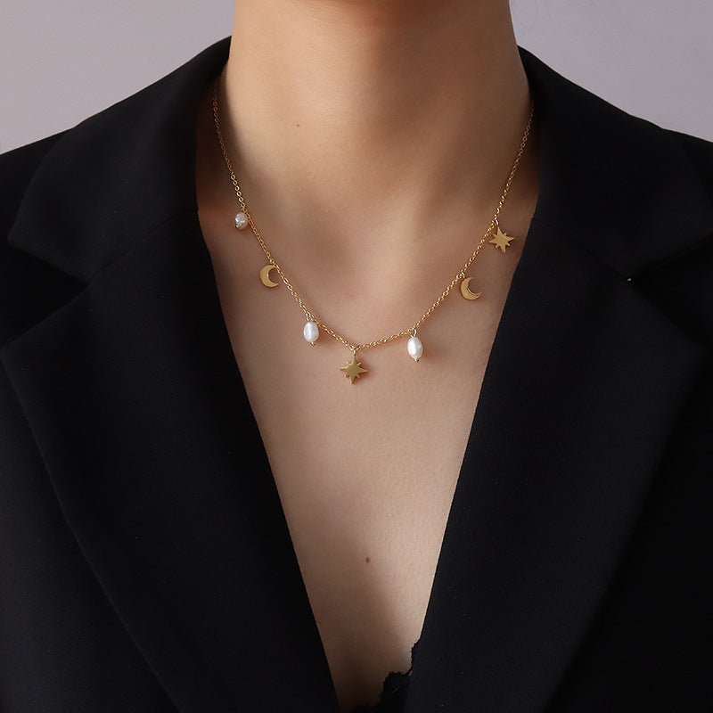 Celestial Charm Gold Choker Necklace with stars, moons, and pearls