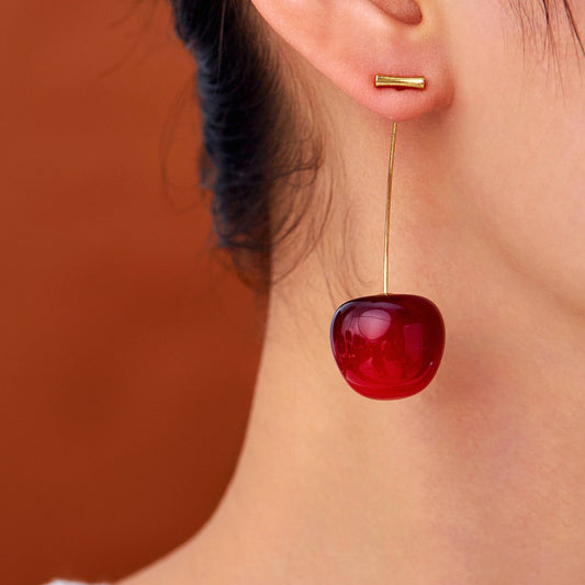 Cherry Pop red cherry earrings on model – glossy fruit-inspired jewellery for women by Orlaya Jewellery