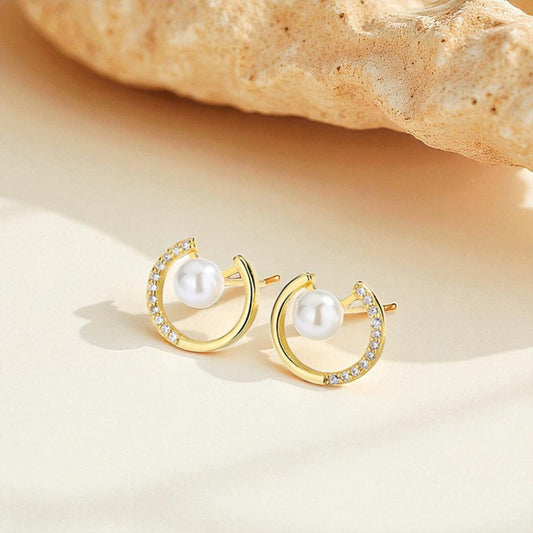 Dayglow Silver Pearl Earrings with a golden arc design, S925 silver studs featuring luminous pearls, blending elegance and everyday style