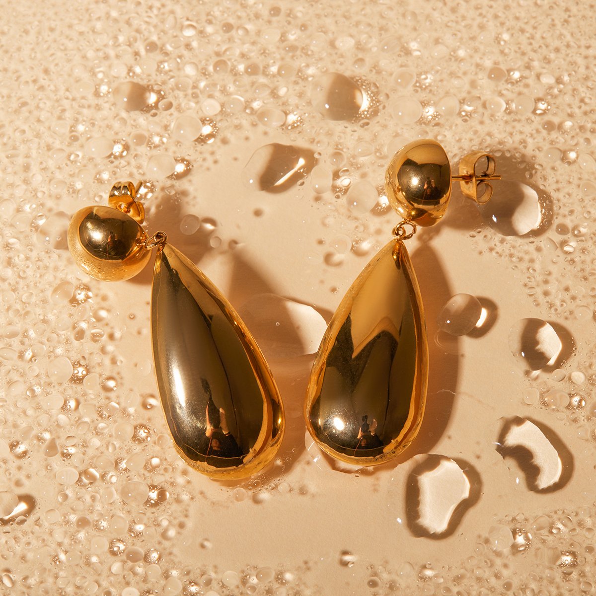 polished, sculptural teardrop earrings crafted from 304 stainless steel with 18K gold plating.