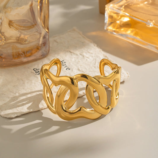 Eterna Heart Cuff Bracelet in sculptural gold interlocked heart design