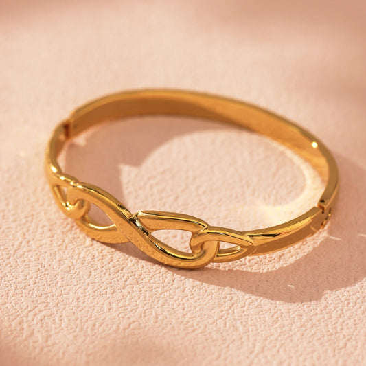 Infinity Bangle Bracelet in gold – unbroken symbolic loop