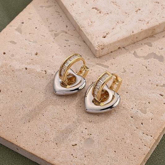 sculpted heart hoop earrings in gold and silver, 18K gold-plated, perfect for everyday chic and evening wear.
