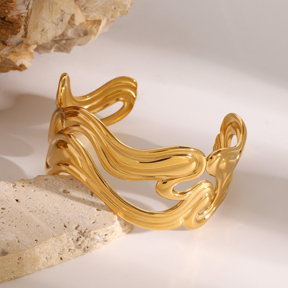 Gold sculptural wave cuff bracelet – bold statement jewellery