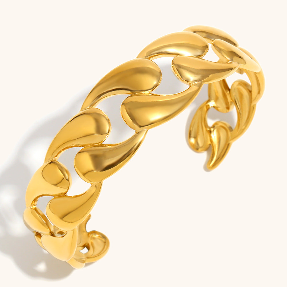 Gold sculptural cuff bracelet with organic teardrop links