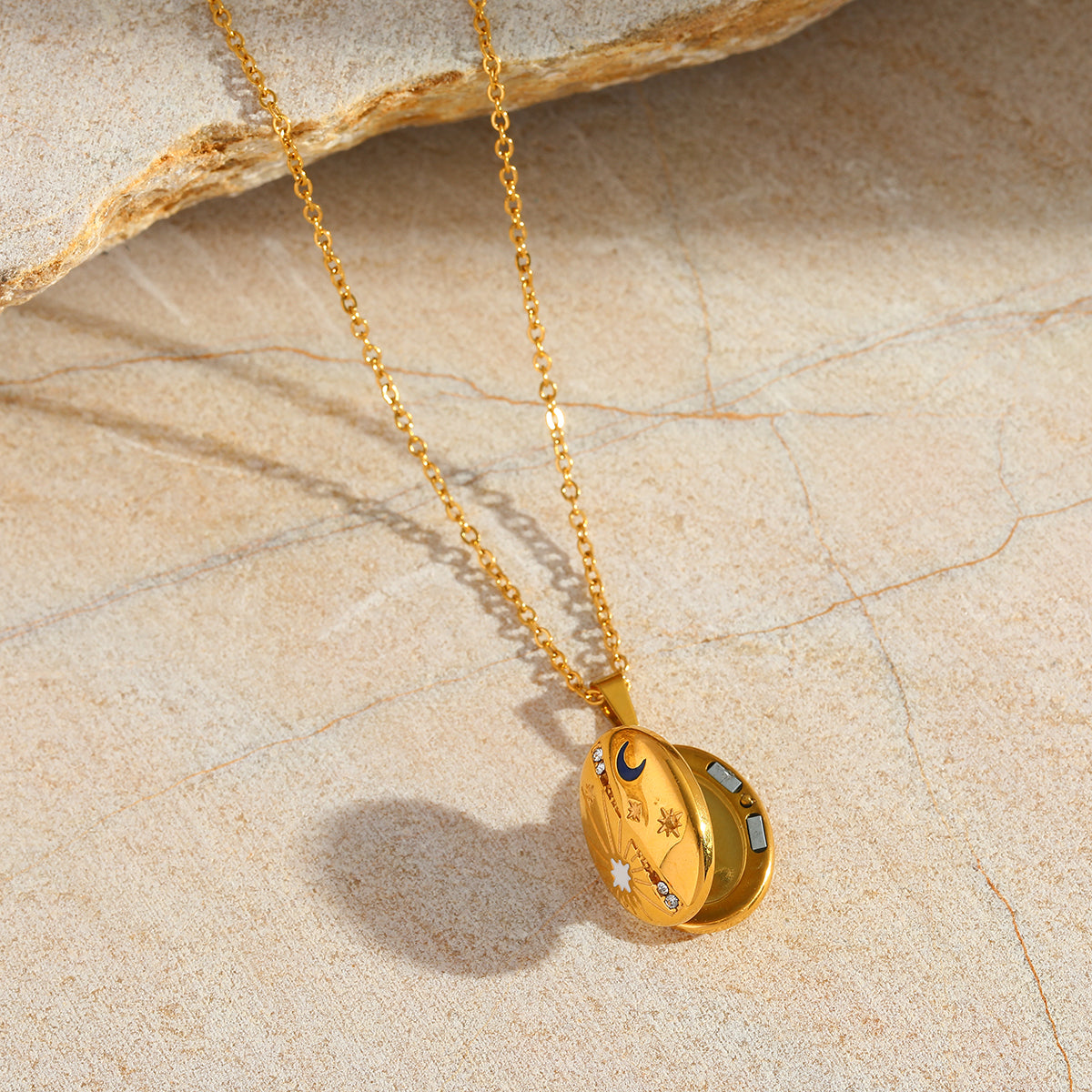 Gold celestial locket necklace with keepsake space inside