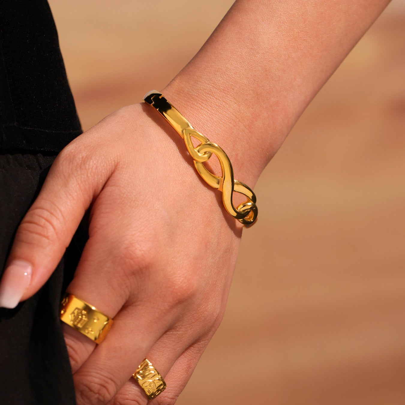 Gold Infinity Bangle Bracelet – symbolic jewellery for women