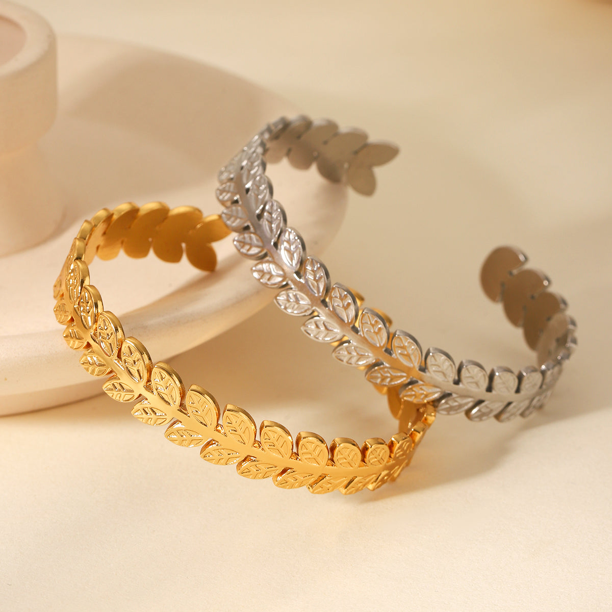 Laurel Crown Cuff Bracelet in gold leaf design on neutral background