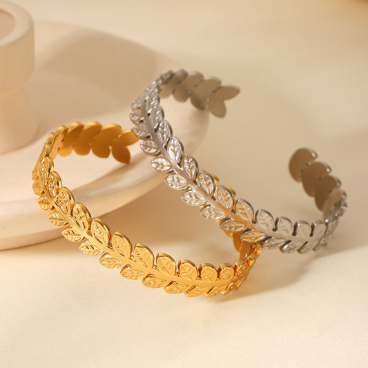 Laurel Crown Cuff Bracelet in gold leaf design on neutral background