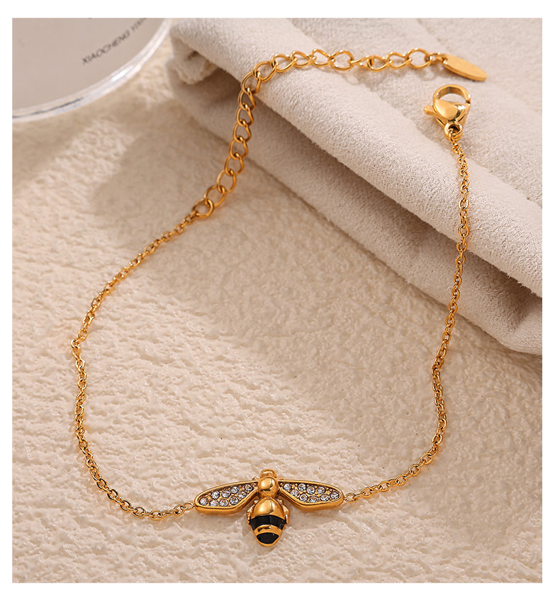 Gold bee charm bracelet – symbolic nature inspired jewellery