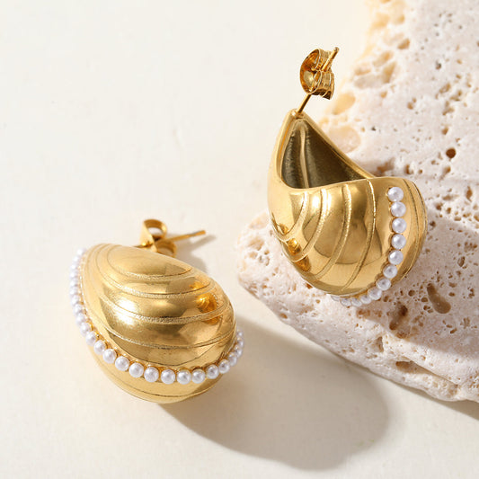 Shell Poise earrings shaped like seashells with delicate pearl detail – ocean-inspired jewellery for women by Orlaya Jewellery