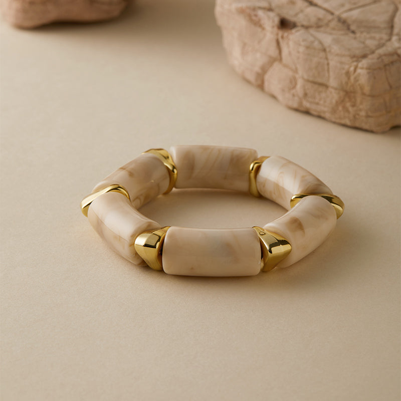 Ivory and amber resin bangle set with golden detailing