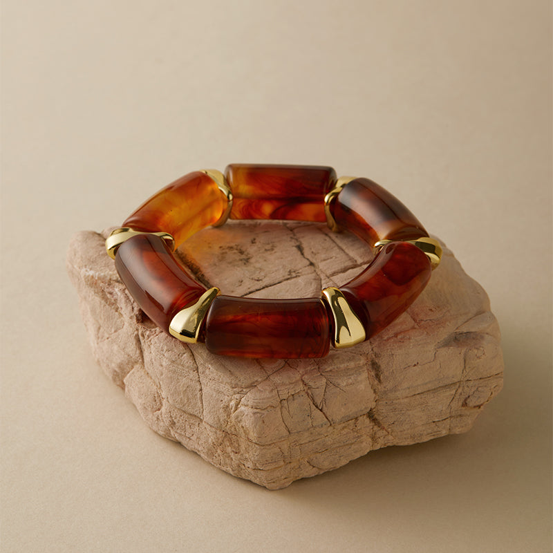 amber resin bangle with golden detailing Orlaya