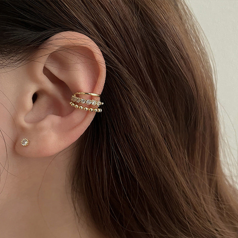 Close-up of Whisper Stacks sterling silver ear cuffs on ear – Orlaya Jewellery