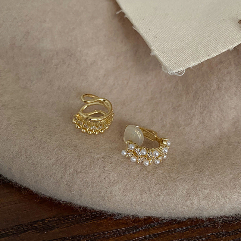 Whisper Stacks sterling silver ear cuffs displayed on neutral background – Orlaya Jewellery
